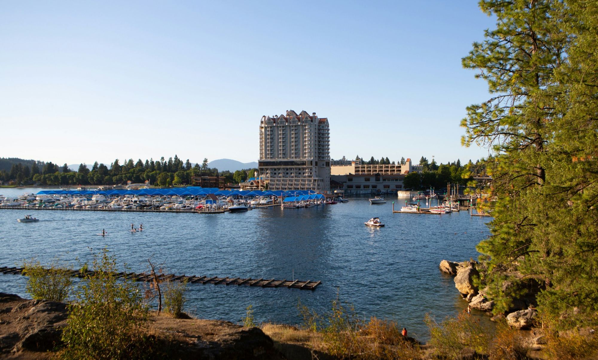 The Coeur d'Alene Resort and marina seen across the lake from Tubbs Hill on a summer evening